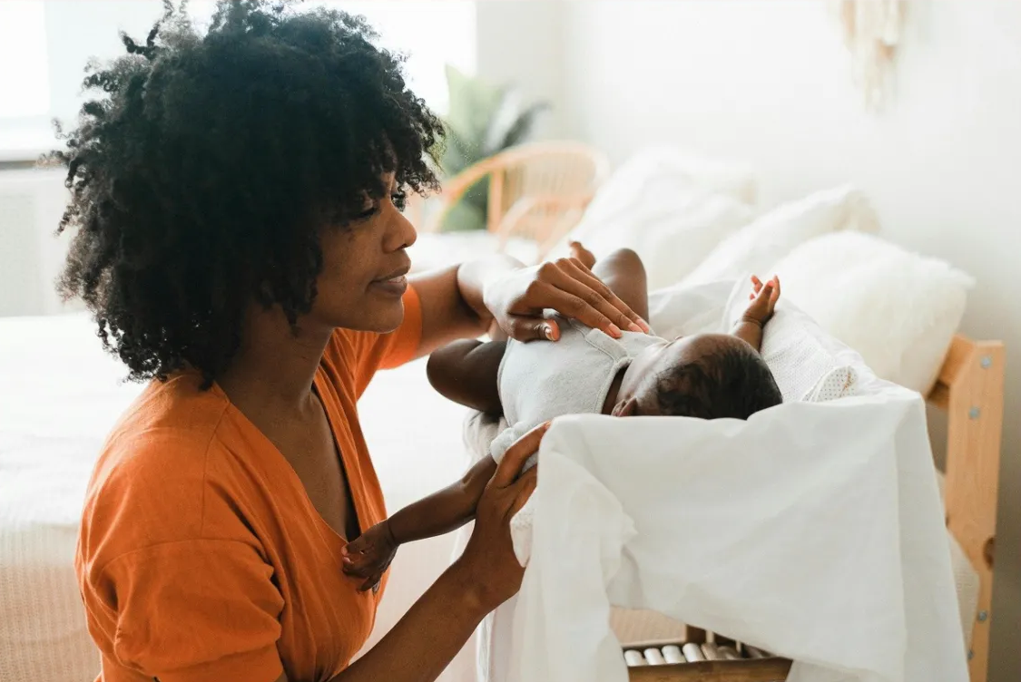 Mother caring for her newborn baby